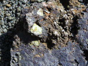 Green crystals forming on the crater rock.